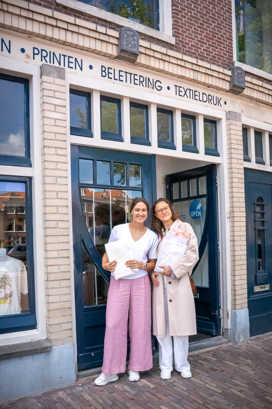 Anna and Isabella, founders of Letters of Presence, outside the print shop