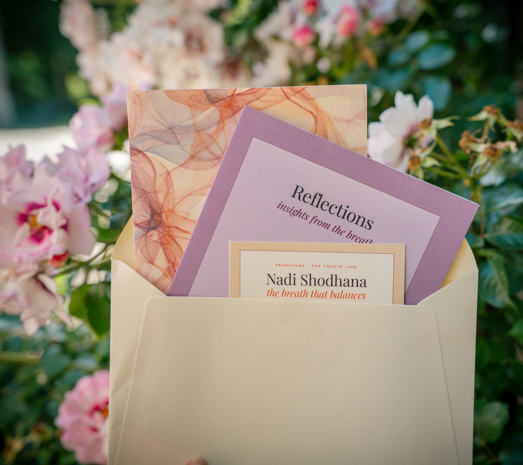 A Letters of Presence envelope with three printed cards emerging from it